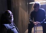 Brother Cavil (Dean Stockwell) interrogates Colonel Tigh (Michael Hogan) in Season 3 of Battlestar Galactica