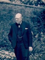 English-prime-minister-winston-churchill-standing-alone-in-a-garden-during-wwii