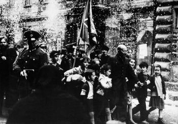 Korczak leading them through the streets