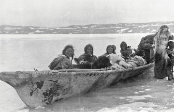Image of several Copper Inuit people in a canoe