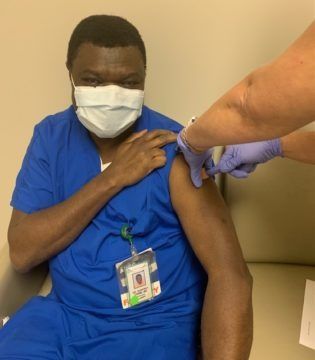 Godfrey Onime, MD (myself) receiving the COVID-19 vaccine.