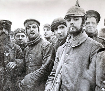 Riflemen Andrew and Grigg (center)—British troops from London—during the Christmas Truce with Saxons of the 104th and 106th Regiments of the Imperial German Army. 
