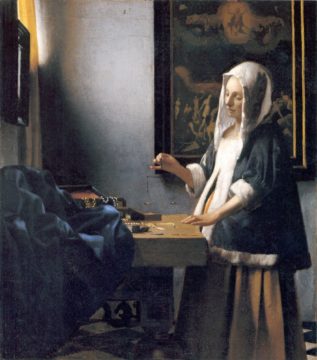 woman holding a balance johannes vermeer 1664