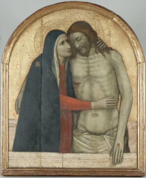 The background is gold, and the shape of the picture is like a domed window, arched at the top with squared sides and bottom. A grieiving mother, draped in dark blue, holds her dead sons body, which leans against her.